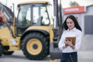 Working woman with an orange tablet in hands