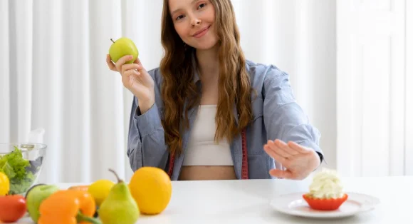 Medium shot woman holding fruit-how to lose 30 pounds in 6 months