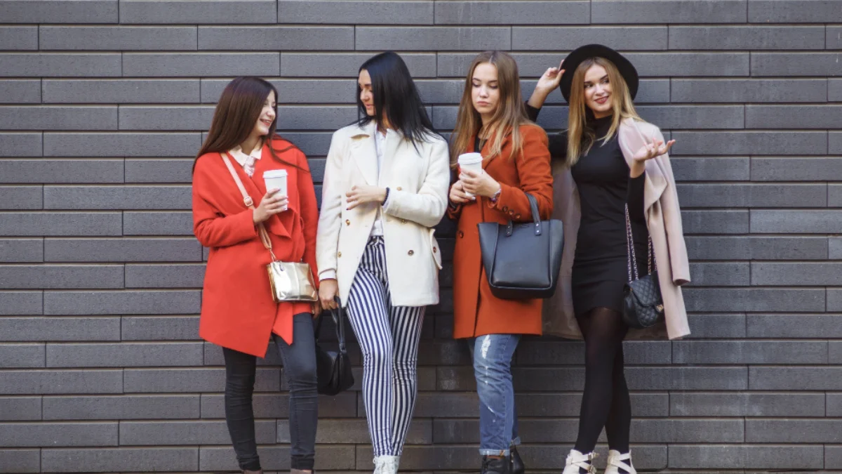 Group of stylish women wearing fall and spring 2025 runway-inspired outfits.