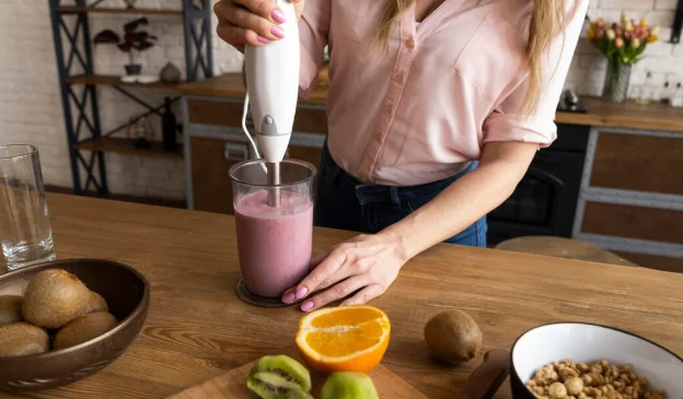 Close up hand making smoothie-Protein shakes in pregnancy