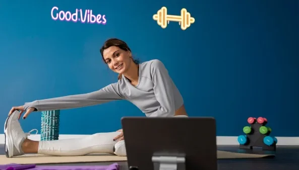 Female fitness instructor using tablet to teach a class from home-how much weight one can lose in 3 months