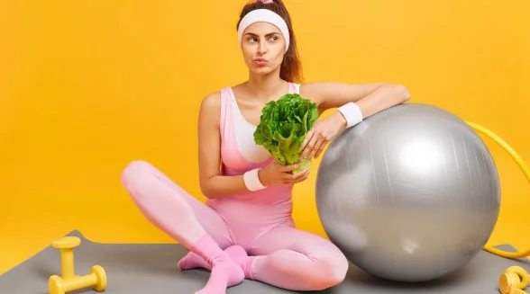 Woman keeps to diet has regular fitness training for keeping fit