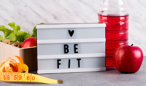 Love be fit inscription on board with food-how to lose 30 pounds in 6 months