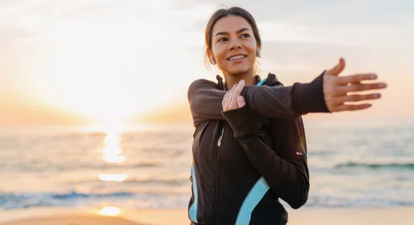 Young attractive slim woman doing sport exercises-what does it mean to be healthy