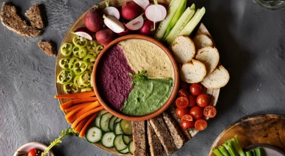 Top view over colorful hummus