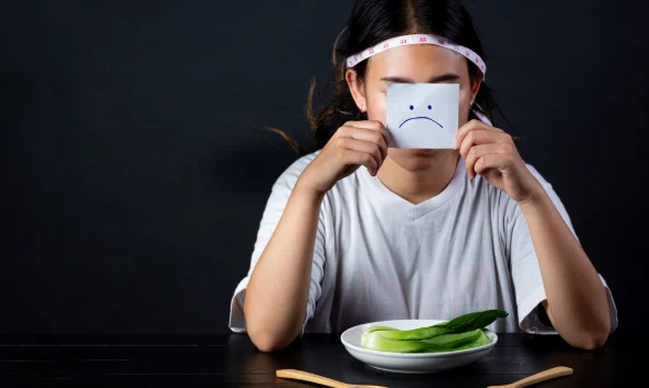 Depressed woman hungry from dieting-the meal is not over when i m full