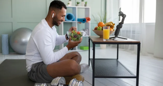 Full shot man eating eating salad-how to lose 30 lbs in 2 months