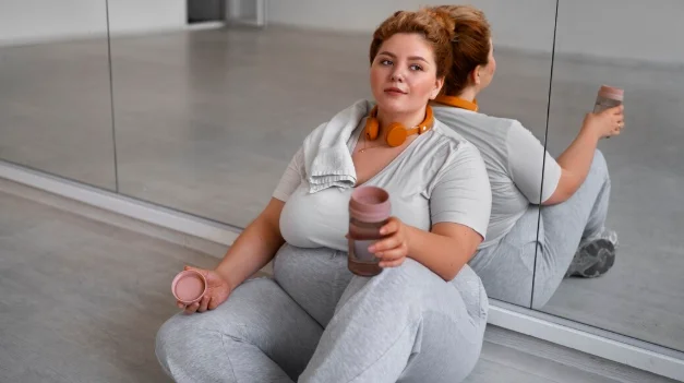 Side view professional plus size dancer training-how much weight one can lose in 3 months