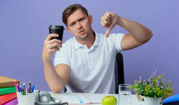 young handsome male holding cup of coffee his thumb down-How Much Weight You Can Lose in 3 Months