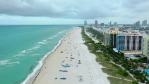 Aerial view of Miami beachfront with luxury condos along the coast