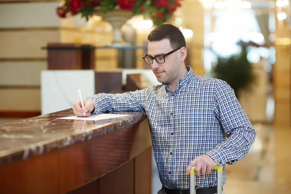 Guest booking directly at a luxury inn reception