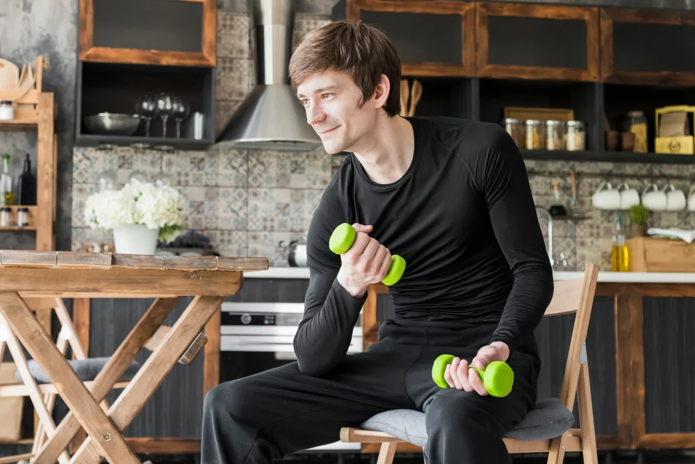 Man wearing gym clothes at a dinner table