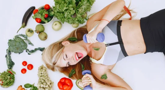 Healthy eating. dieting and people concept. blonde lying on the floor.