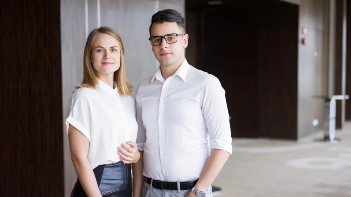 Professionals in summer business casual outfits in office