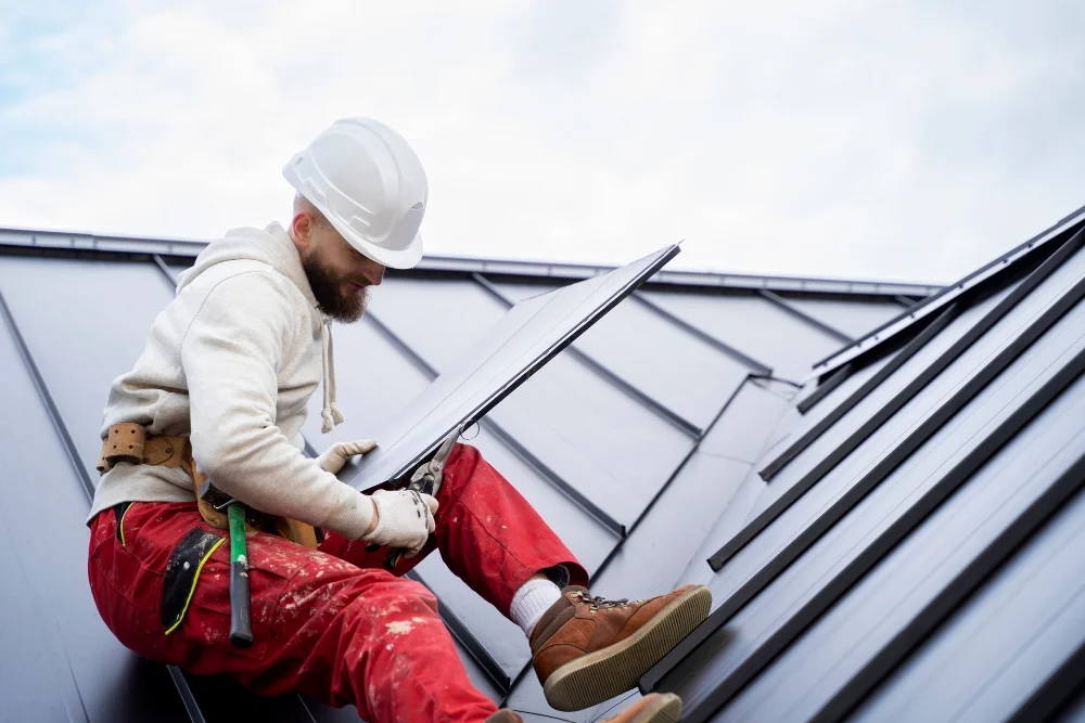 Roofer installing a skylight