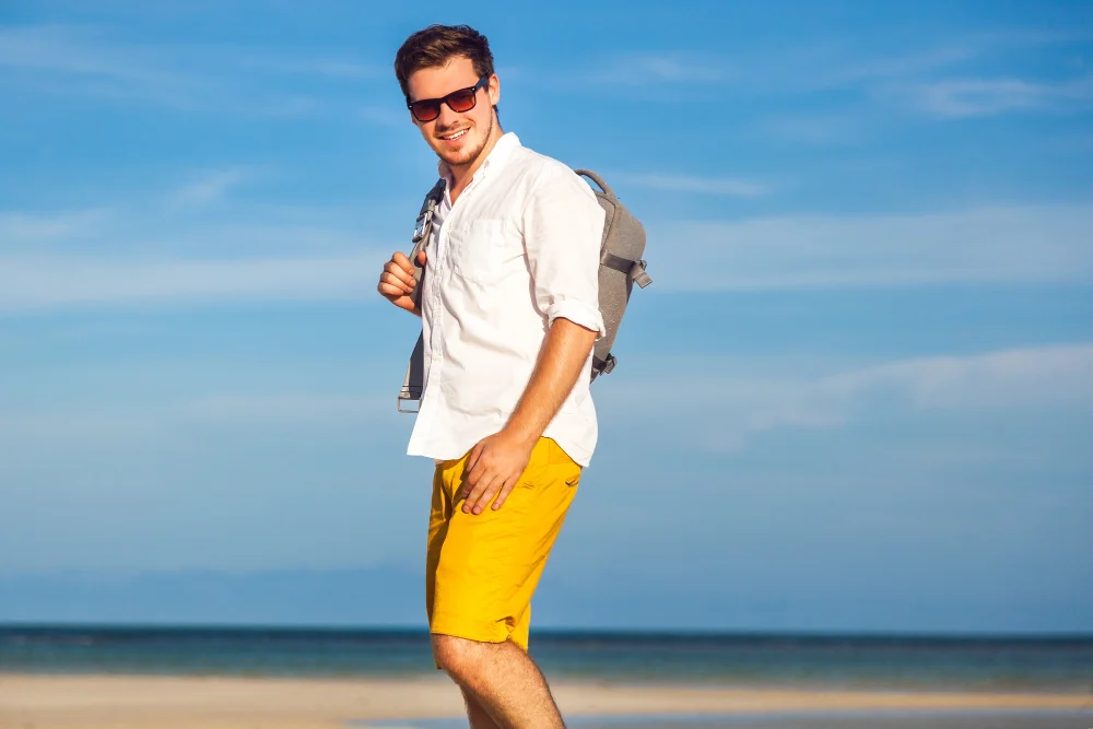 Summer casual outfit idea for men with T-shirt and tailored shorts.