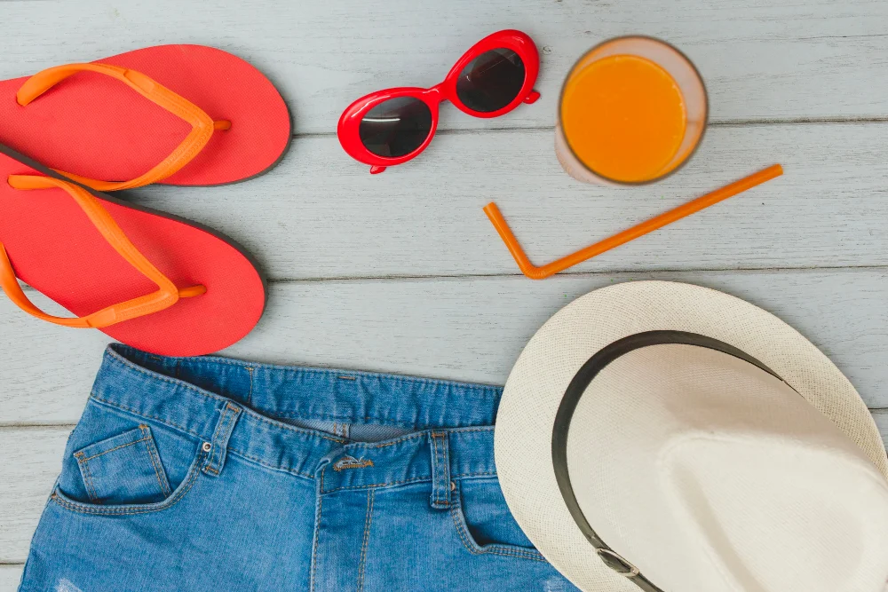 Summer essentials on a wooden surface